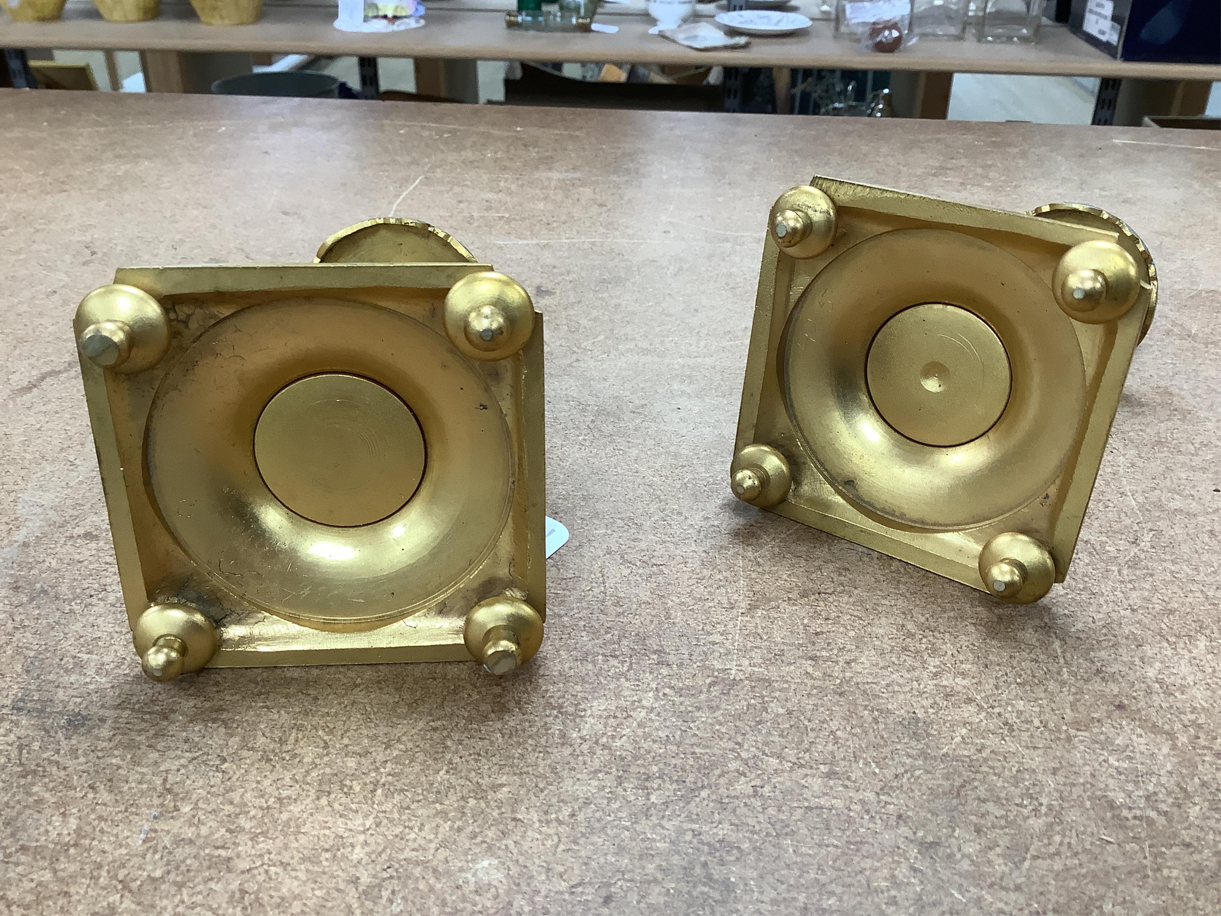 A pair of late 19th century French champleve enamel and ormolu candlesticks, 17cm